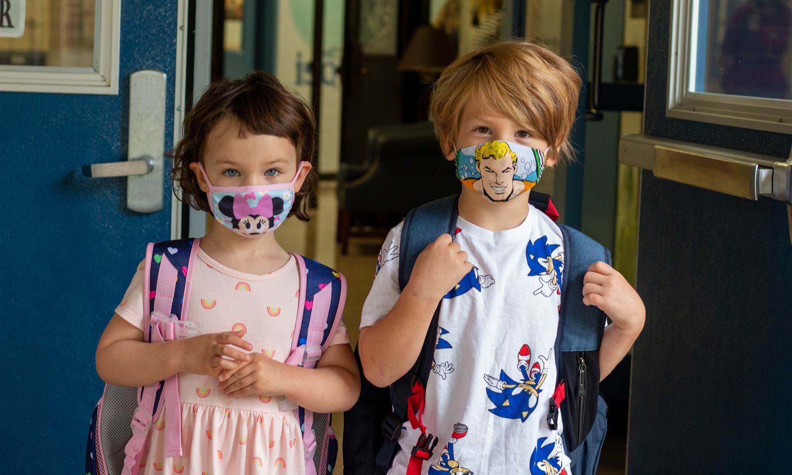 Two students wear masks